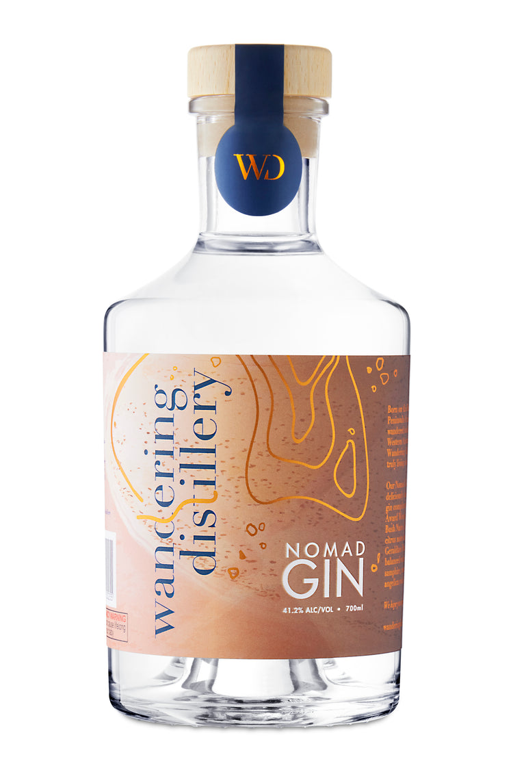 Wandering Distillery Nomad Gin bottle front shot on white background.
